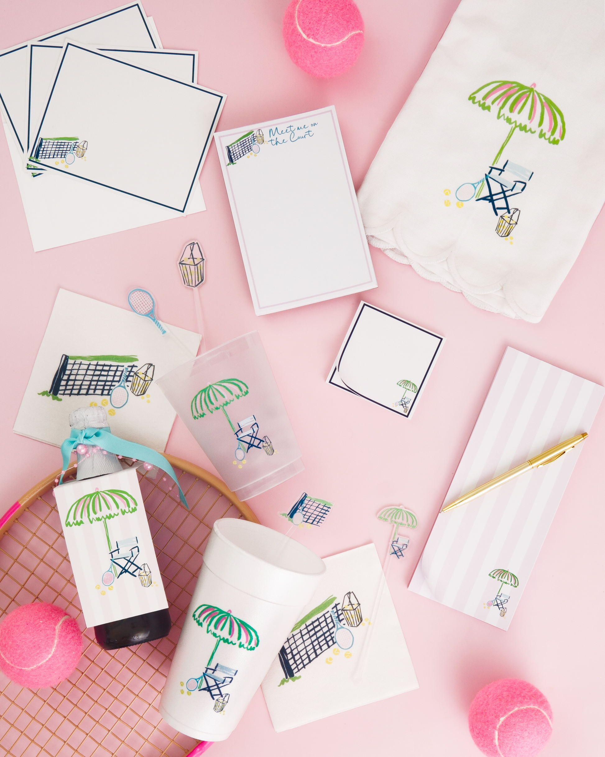 various items related to tennis, including tennis balls, a tennis racket, and tennis-themed stationery.